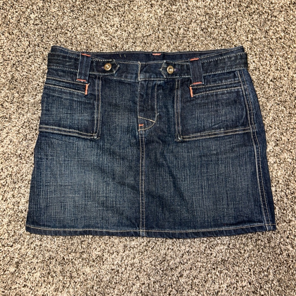 Denim mini skirt with orange stitching